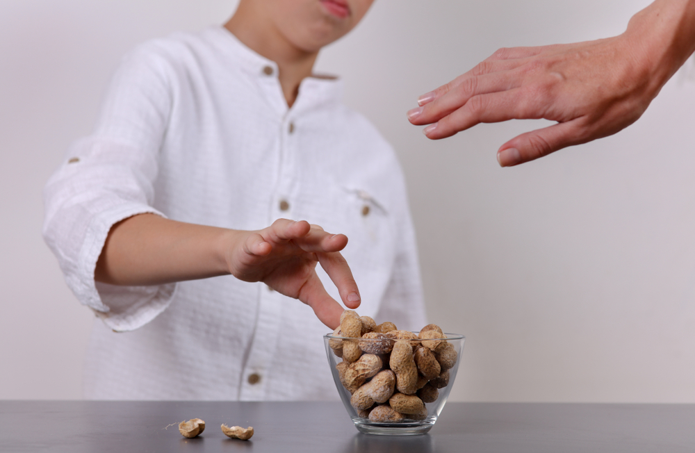 Danger Allergy! Mother stops child from eating peanuts