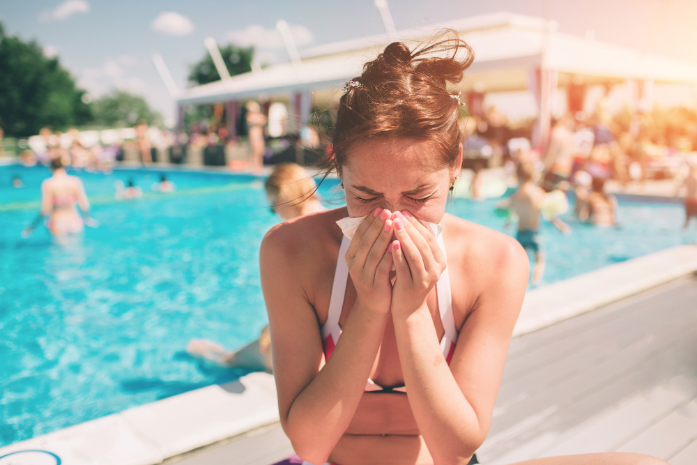 picture from a Beautiful women in bikini with handkerchief. She is sick in the summer on vacation